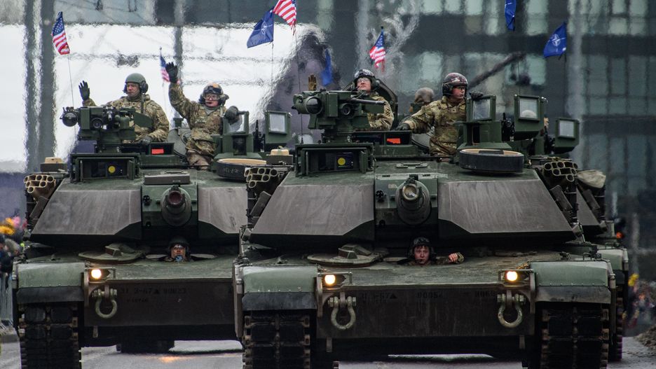 VILNIUS, LITHUANIA - 2023/11/25: U.S. Army Abrams tanks take part in a military parade during Armed Forces Day in Vilnius. Armed Forces Day honours the restoration of the Lithuania armed forces on November 23, 1918. The military parade commemorating the holiday is being held this year on November 25 in Vilnius. Both Lithuanian military and allies from NATO countries took part in the parade, totaling about 1,400 people and 100 pieces of military equipment. (Photo by Yauhen Yerchak/SOPA Images/LightRocket via Getty Images)