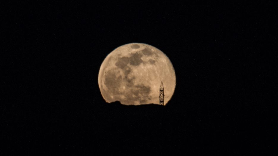 Full moon, Snow Supermoon, rising over the harbor of Nea Artaki, Euboea, on February 9, 2020(Photo by Wassilios Aswestopoulos/NurPhoto via Getty Images)