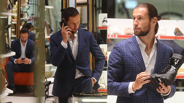 Elegancki Grzegorz Krychowiak buszuje w sklepie z butami 
