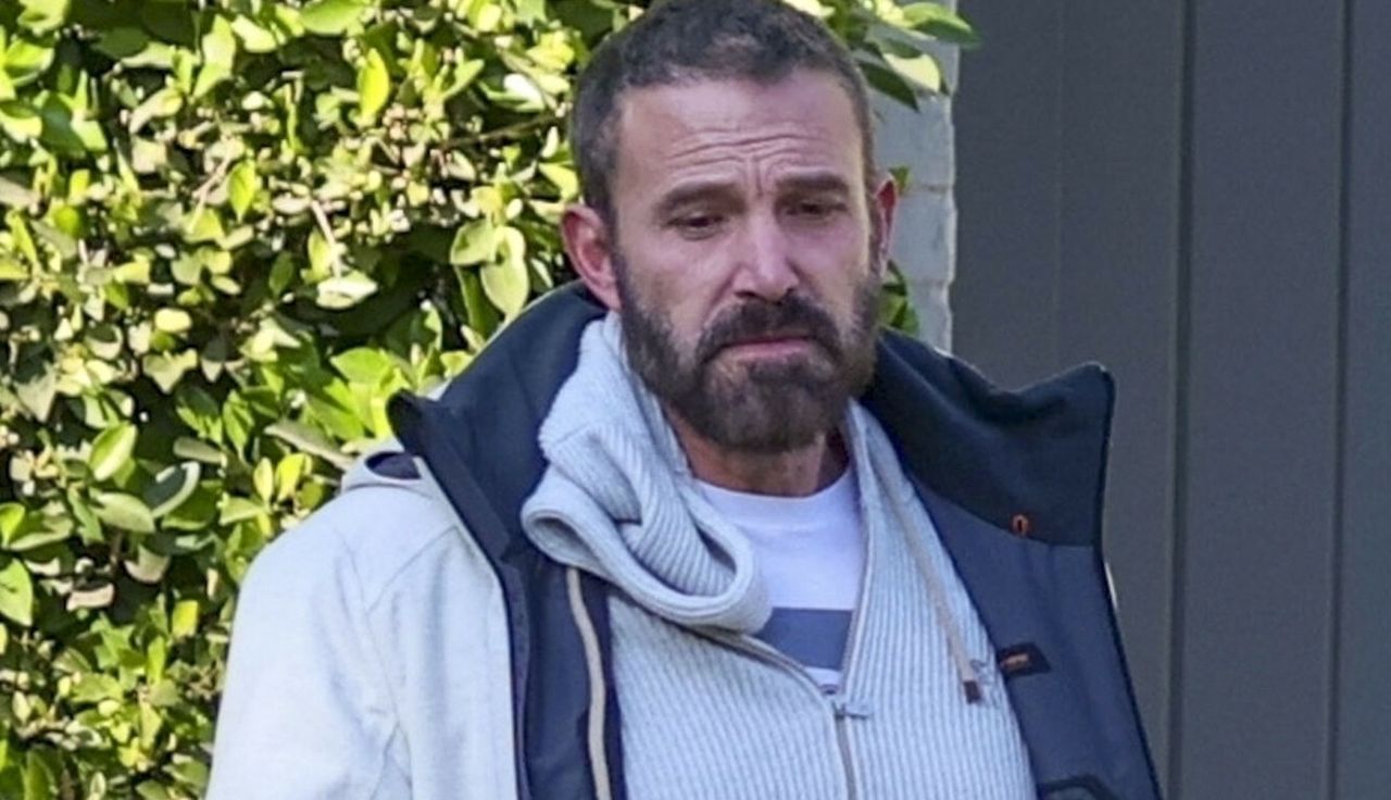 Ben Affleck in front of his house, checking if everything is alright.