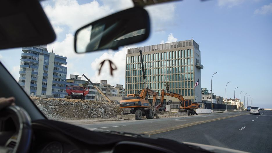 HAVANA, CUBA - DECEMBER 17: Heavy construction machinery takes down the so-called Mountain of Flags, Monte de las Banderas, in front of the US embassy, on December 17, 2020 in Havana, Cuba. The Mountain of the Flags, built in 2006 under then President Fidel Castro, consisted of 138 black flags with white stars representing the years of Cubas struggle for independence and was used for protests against the US. The monument had recently suffered serios damage by hurricanes. The construction work takes place as Cuba fights the outbreak of the pandemic. The Ministry of Health has confirmed 100 new infections for December 16, for a total of 9771 infection cases and 137 deaths of Covid-19. (Photo by Sven Creutzmann/Mambo photo/Getty Images)