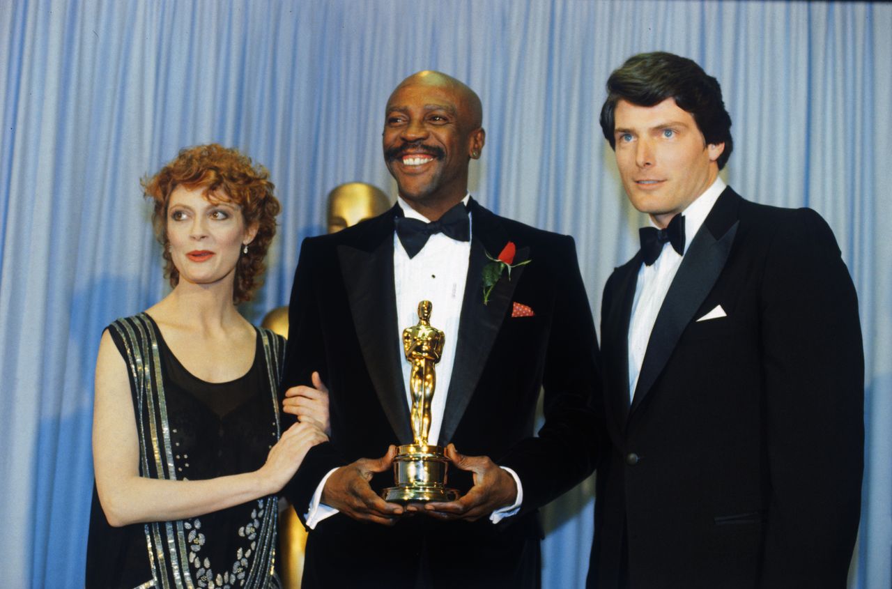 Susan Sarandon, Louis Gossett Jr., and Christopher Reeve at the Oscar gala in 1983.