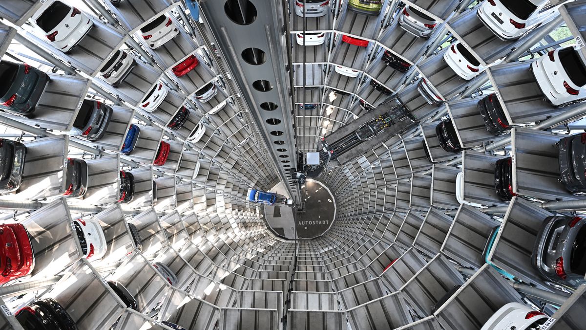 WOLFSBURG, GERMANY - SEPTEMBER 07: Volkswagen cars stand on elevator platforms inside one of the twin towers used as storage at the Autostadt promotional facility next to the Volkswagen factory on September 07, 2023 in Wolfsburg, Germany. Volkswagen announced recently that it is temporarily cutting some shifts and lowering production at Wolfsburg and other plants due to a lack of critical engine components. Flooding in Slovenia disrupted production at gear rings manufacturer KLS Ljubno, which supplies Volkswagen and other European automobile factories. Electric car production is not affected. (Photo by Stuart Franklin/Getty Images)