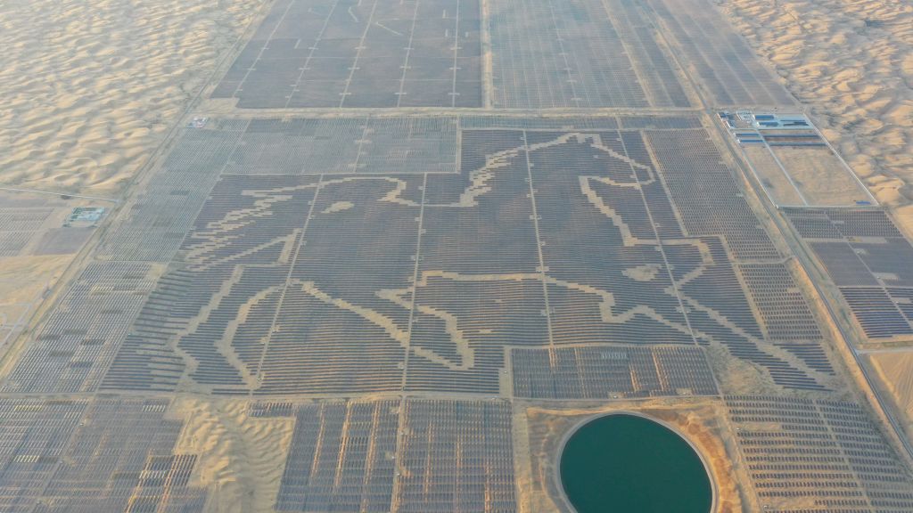 The World's Largest "Horse" Shaped Photovoltaic Power StationORDOS, CHINA - JULY 17, 2022 - Aerial photo taken on July 17, 2022 shows the "Steed Power Station" of Tianci Lake Photovoltaic power generation project of State Power Corporation of Inner Mongolia, In Zhaojun Town, Dalat Banner, Ordos City, North China's Inner Mongolia Autonomous Region. Dalat Photovoltaic Power Generation Application Leading base consists of 196,300 photovoltaic panels. The power station promotes ecological management of the Desert while exploiting and utilizing abundant solar energy resources in the Kubuqi Desert. Up to now, the "Steed" photovoltaic graphics power station has generated a total of 1.371 billion KWH of electricity (put into operation on December 17, 2018). The photovoltaic power plant was certified by guinness World Records on July 9, 2019. (Photo credit should read CFOTO/Future Publishing via Getty Images)Future Publishingchina, chinese, photovoltaic, power, desert, state