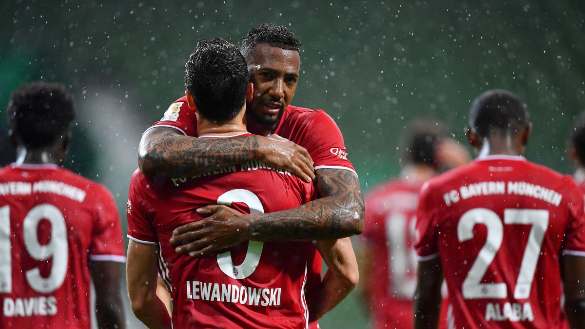 BREMEN, GERMANY - JUNE 16: Robert Lewandowski of Bayern Munich celebrates with teammate Jerome Boateng of Bayern Munich after scoring his team's first goal during the Bundesliga match between SV Werder Bremen and FC Bayern Muenchen at Wohninvest Weserstadion on June 16, 2020 in Bremen, Germany. (Photo by Stuart Franklin/Getty Images)