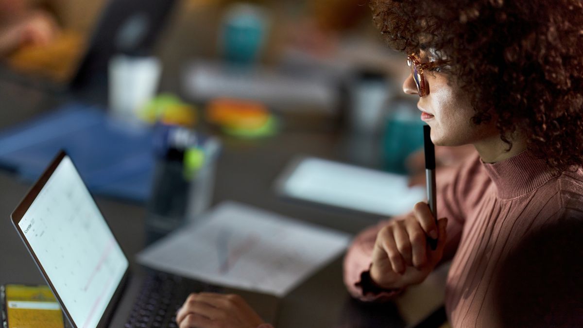 Young female freelancer working on laptop in the office.
Profile view of creative woman brainstorming while working on a computer in the office.
skynesher