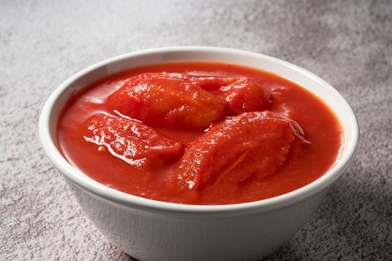 Transfer the tomatoes from the open can