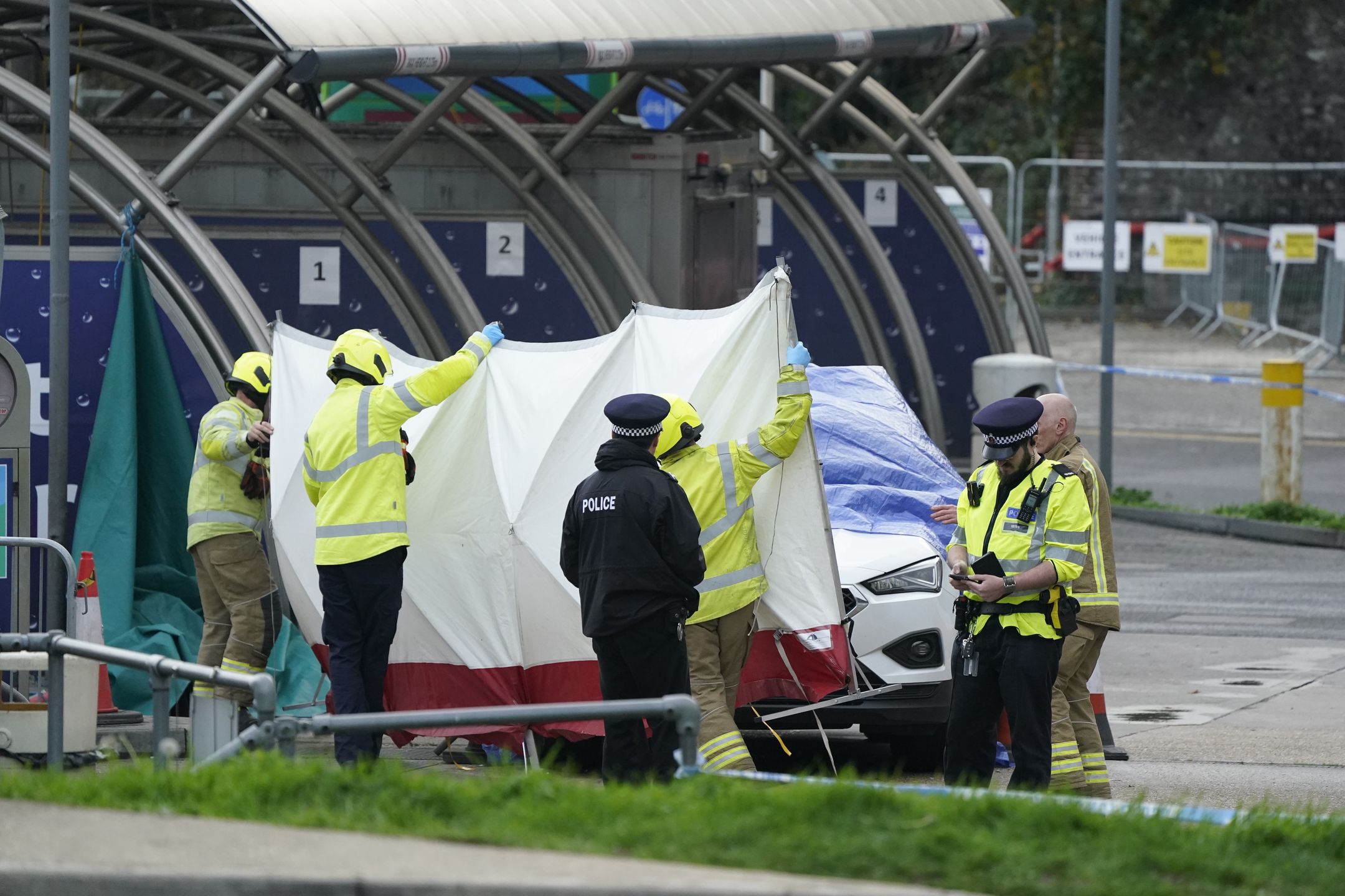 The emergency services erect a tent around the car allegedly involved in an incident near the migrant processing centre in Dover, Kent. Picture date: Sunday October 30, 2022. (Photo by Andrew Matthews/PA Images via Getty Images)