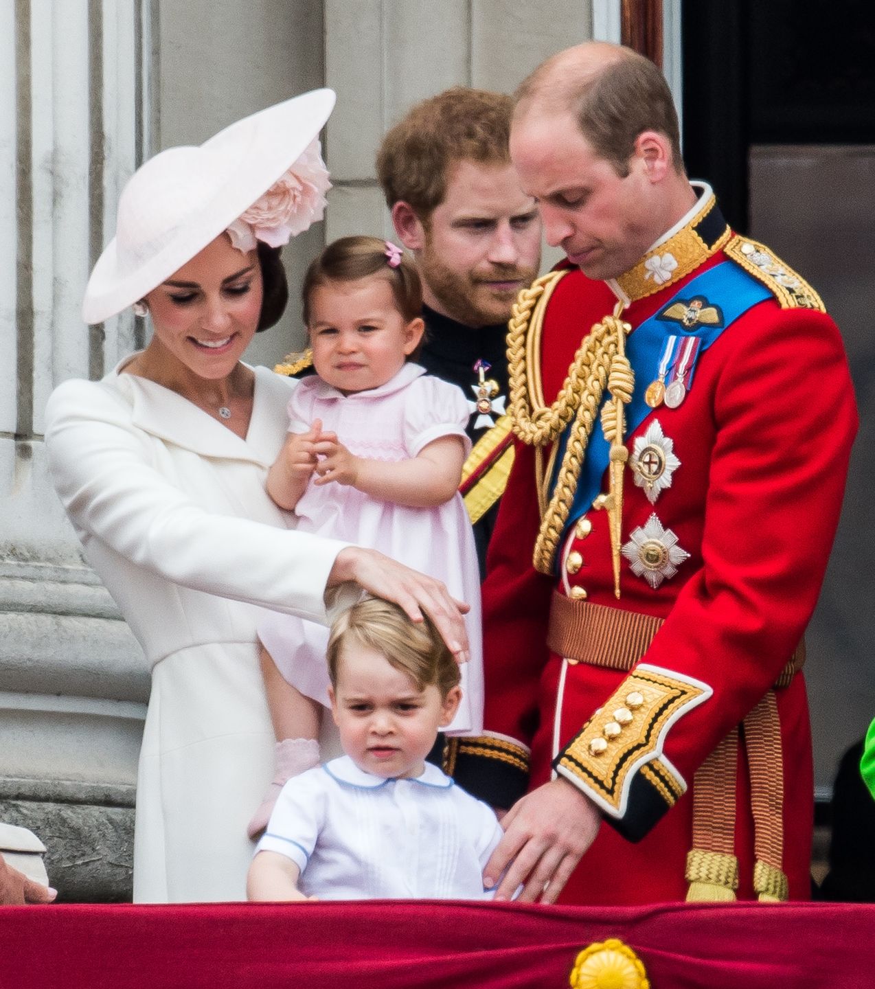 Trooping The Colour 2016LONDON, ENGLAND - JUNE 11:  Catherine, Duchess of Cambridge, Princess Charlotte, Prince George, Prince Harry, Prince William, Duke of Cambridge stand on the balcony during the Trooping the Colour, this year marking the Queen's official 90th birthday at The Mall on June 11, 2016 in London, England. The ceremony is Queen Elizabeth II's annual birthday parade and dates back to the time of Charles II in the 17th Century when the Colours of a regiment were used as a rallying point in battle.  (Photo by Samir Hussein/WireImage)Samir Hussein
