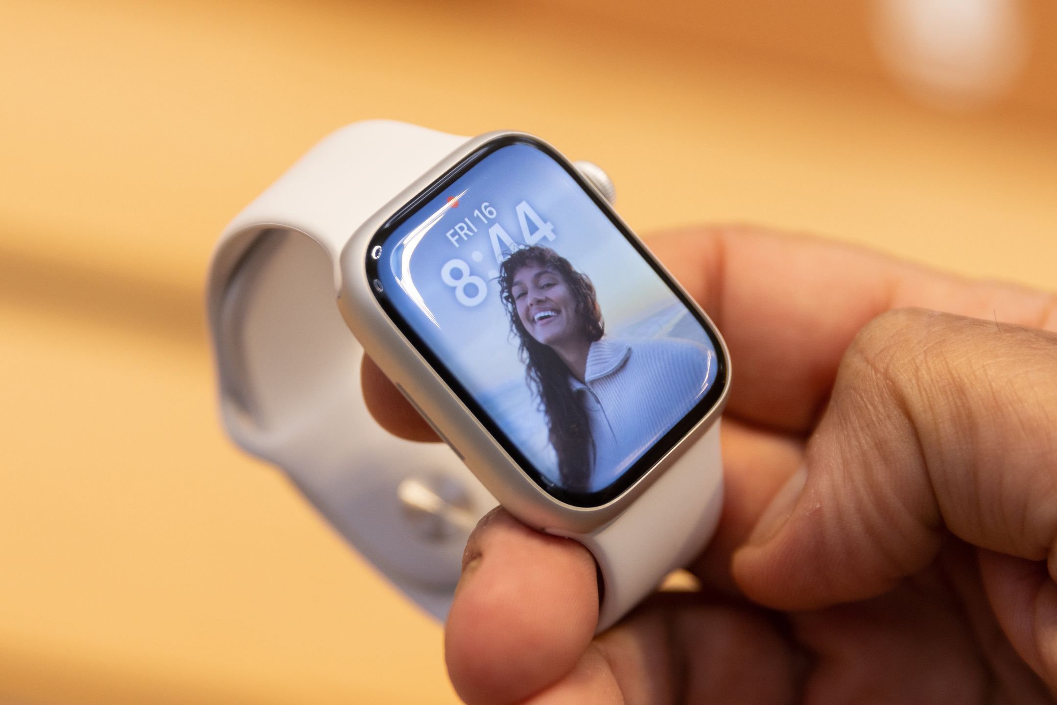 A shopper holds an Apple Watch Series 8 on sale at the company's Fifth Avenue store in New York, US, on Friday, Sept. 16, 2022. The latest iPhone hits stores Friday, and Apple Inc. is counting on well-heeled shoppers to make the device a hit during a year of roaring inflation and shaky technology spending. Photographer: Jeenah Moon/Bloomberg via Getty Images