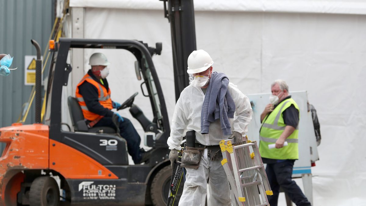 Work continues at the construction of a temporary morgue at an industrial estate in Glasgow as the UK continues in lockdown to help curb the spread of the coronavirus. (Photo by Andrew Milligan/PA Images via Getty Images)