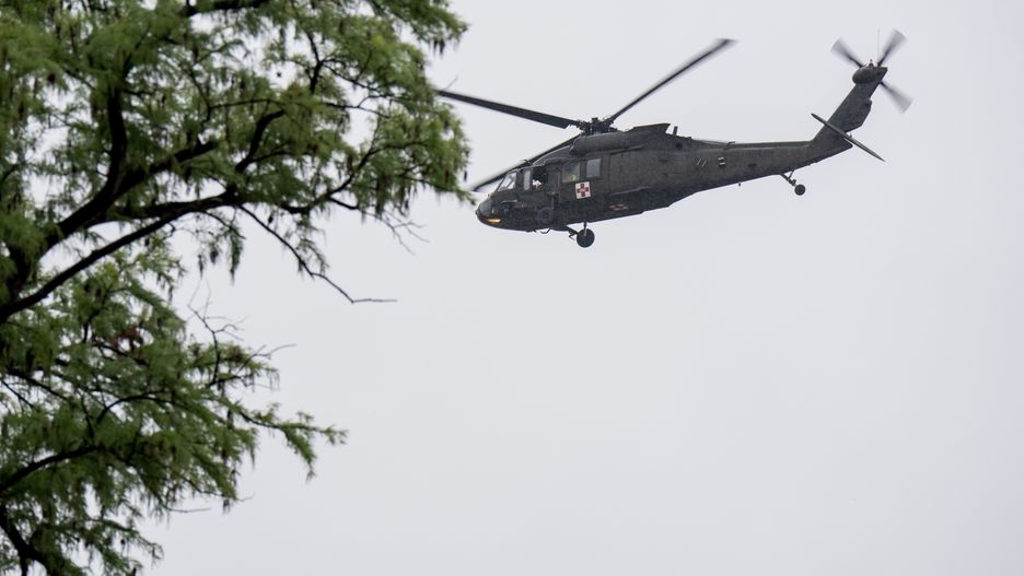 KERRVILLE, TEXAS - JULY 04: A UH-60 Black Hawk helicopter conducts rescue operations along the Guadalupe River on July 4, 2025 in Kerrville, Texas. Heavy rainfall caused flooding along the Guadalupe River in central Texas with multiple fatalities reported. (Photo by Eric Vryn/Getty Images)