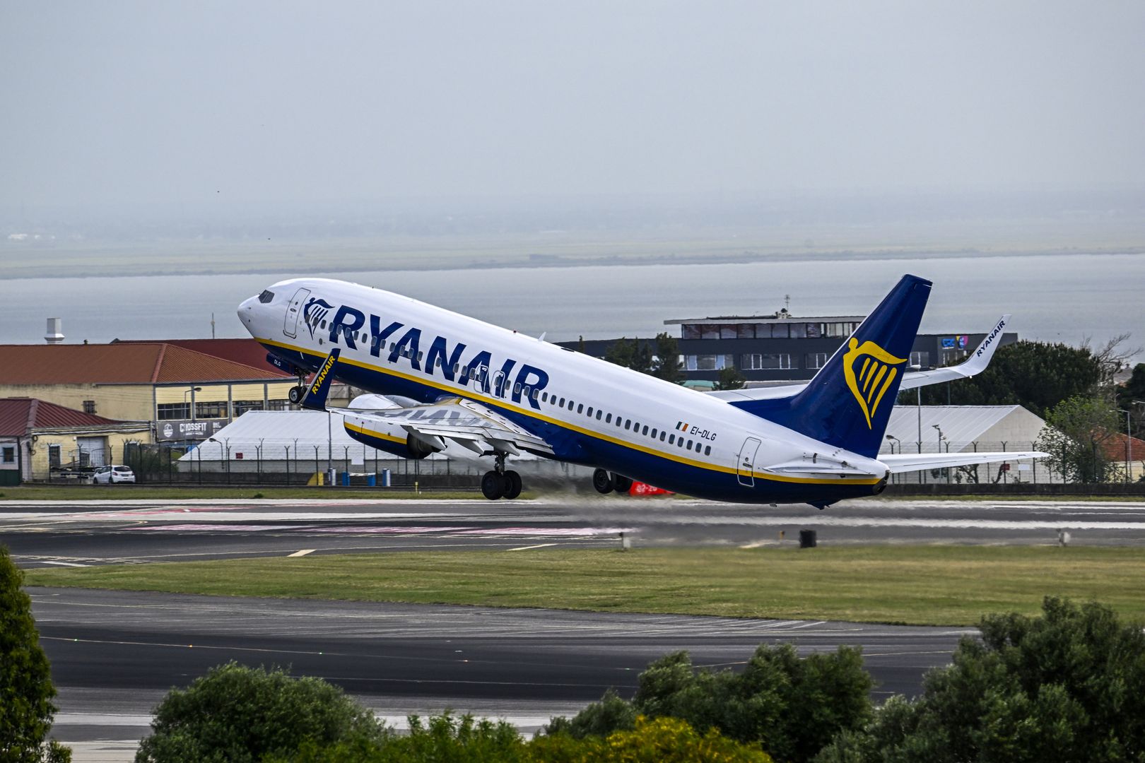 LISBON, PORTUGAL - APRIL 01: A Ryanair aircraft takes off on a busy day in Humberto Delgado International Airport on April 01, 2023, in Lisbon, Portugal. According to the Portuguese National Institute of Statistics (INE), foreign tourists stood out in the overnight stays, totaling 2.7 million in the second month of 2023, up 51 percent year-on-year. The domestic market contributed, in turn, with 1.4 million overnight stays, an increase of 19 percent compared to February 2022. Hotel stays continued to grow in February compared to the same month last year, with 1.7 million guests (a 33 percent increase) and four million overnight stays (a 38.5 percent increase). (Photo by Horacio Villalobos#Corbis/Corbis via Getty Images)