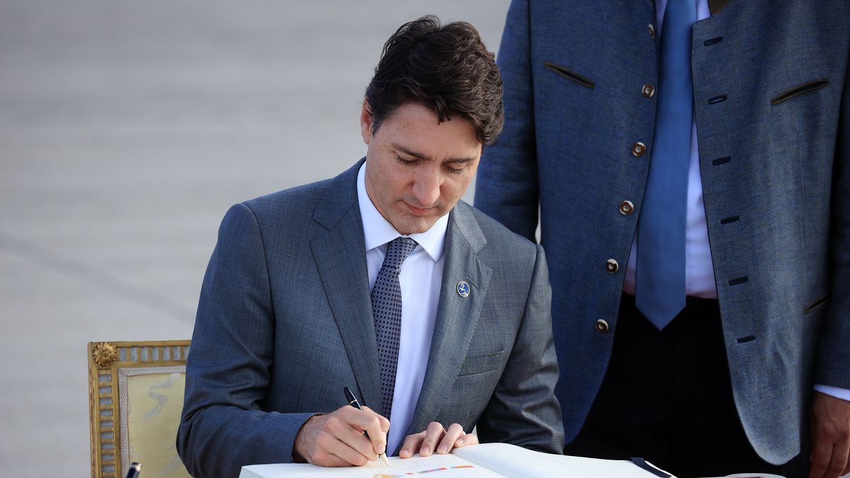 Justin Trudeau, Canada's prime minister, signs a guest book as he arrives at Munich Airport ahead of the Group of Seven (G-7) leaders summit, in Munich, Germany, on Sunday, June 26, 2022. The G-7 leaders hold their summit in the Bavarian Alps starting Sunday hosted by Chancellor Olaf Scholz. Photographer: Krisztian Bocsi/Bloomberg via Getty Images