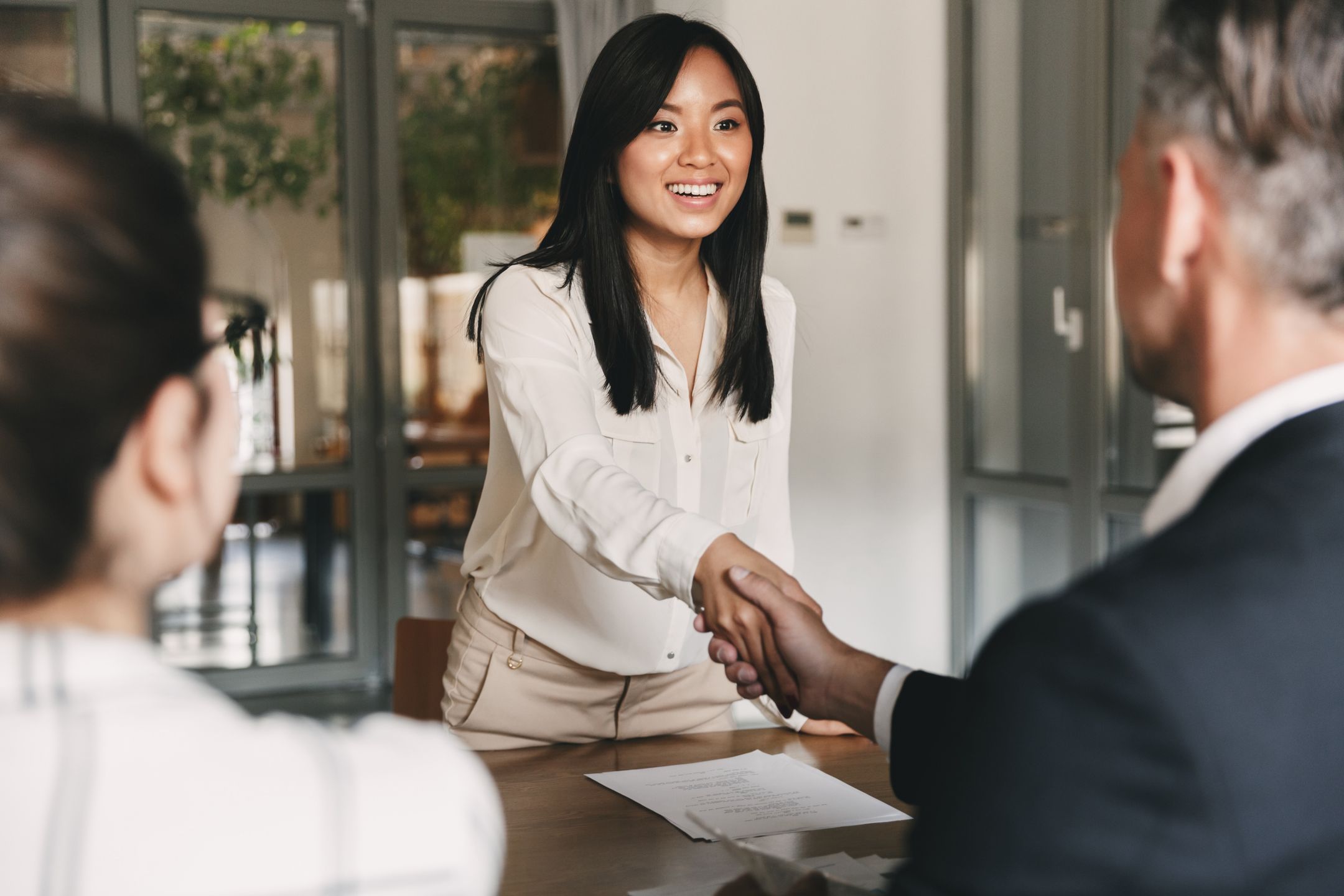 Business, career and placement concept - image from back of two employers sitting in office and shaking hand of young asian woman after successful negotiations or interview
hire, applicant, employer, business, businessman, businesswoman, candidate, asian, communication, contract, cooperation, corporate, corporation, discuss, employee, employment, group, interact, interview, job, manager, meeting, mentor, negotiation, offer, office, people, men, personnel, placement, recruitment, resume, teamwork, woman, work, worker, young, committee, members, sitting, table, talk, directors, career, hand, handshake, handshaking, shaking, deal