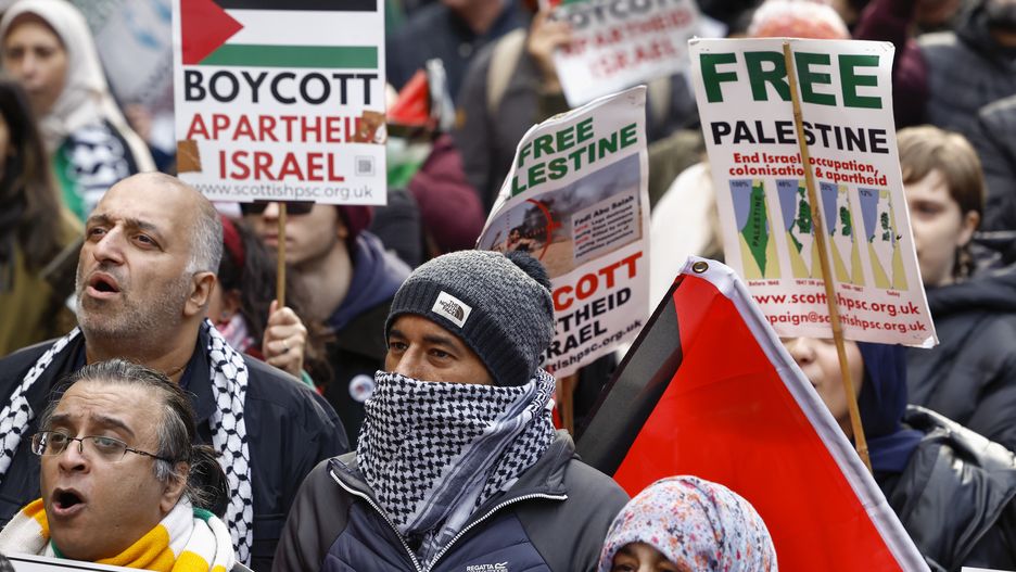 GLASGOW, SCOTLAND - OCTOBER 14: Supporters of Palestine participate in a rally at the Buchanan Street steps on October 14, 2023 in Glasgow, Scotland. Groups supporting Palestine protest at Israel's retaliation to Hamas attacks across the UK this weekend despite the Home Secretary, Suella Braverman, suggesting that waving Palestinian flags and using popular pro-Palestine slogans could be illegal under the Public Order Act in a letter she sent to police chiefs in England and Wales on Tuesday. (Photo by Jeff J Mitchell/Getty Images)