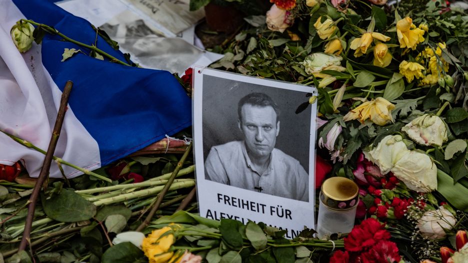 BERLIN, GERMANY - 2024/03/01: A picture of Russian opposition leader Alexey Navalny seen around flowers on the day of his funeral at a memorial in front of the Russian embassy in Berlin. (Photo by Nicholas Muller/SOPA Images/LightRocket via Getty Images)