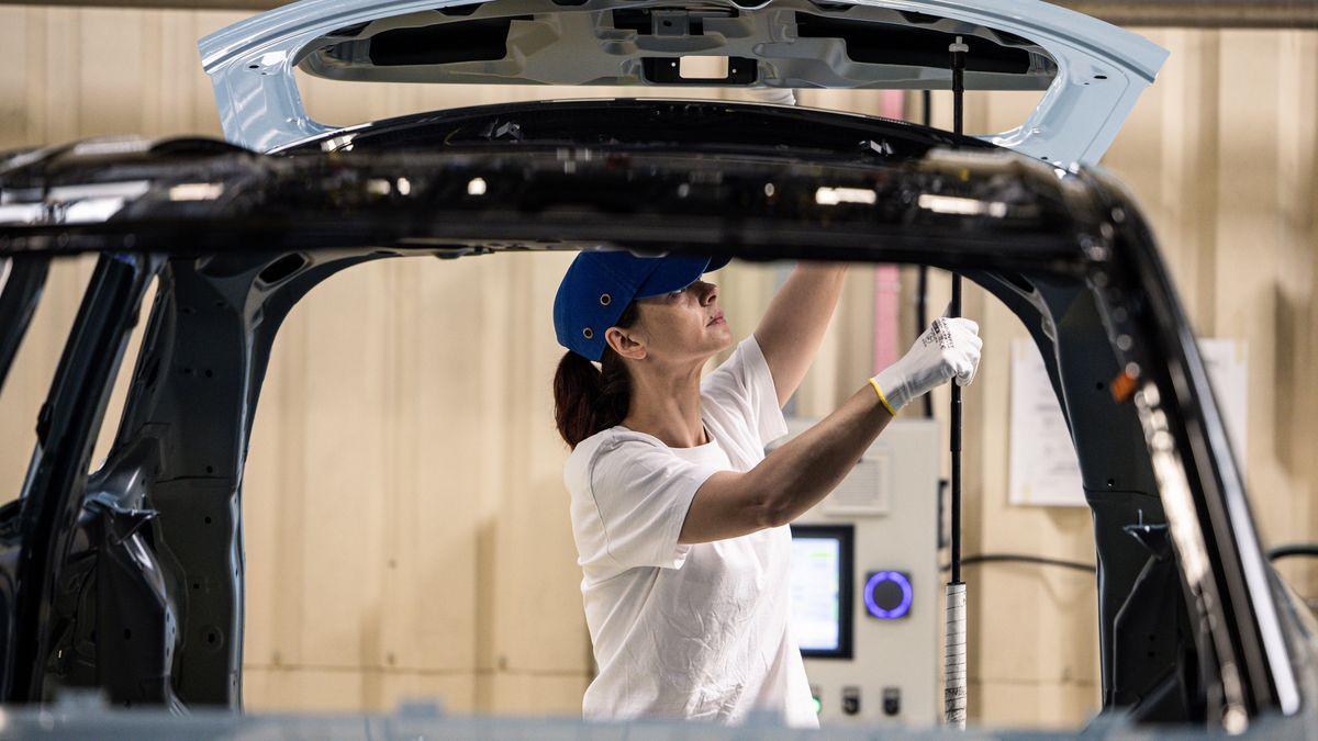 An employee works on the boot panel of an automobile on the assembly line inside the Suzuki Motor Corp. plant in Esztergom, Hungary, on Wednesday, Oct. 19, 2022. European automotive stocks gained a boost from figures showing that new car sales in the region rose for a second month in September as supply-chain issues eased. Photographer: Akos Stiller/Bloomberg via Getty Images