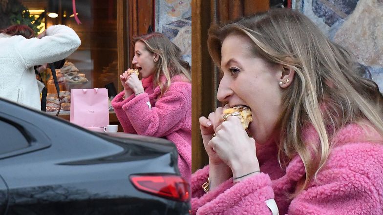 Lara Gessler zajada się pączkiem na ulicy 