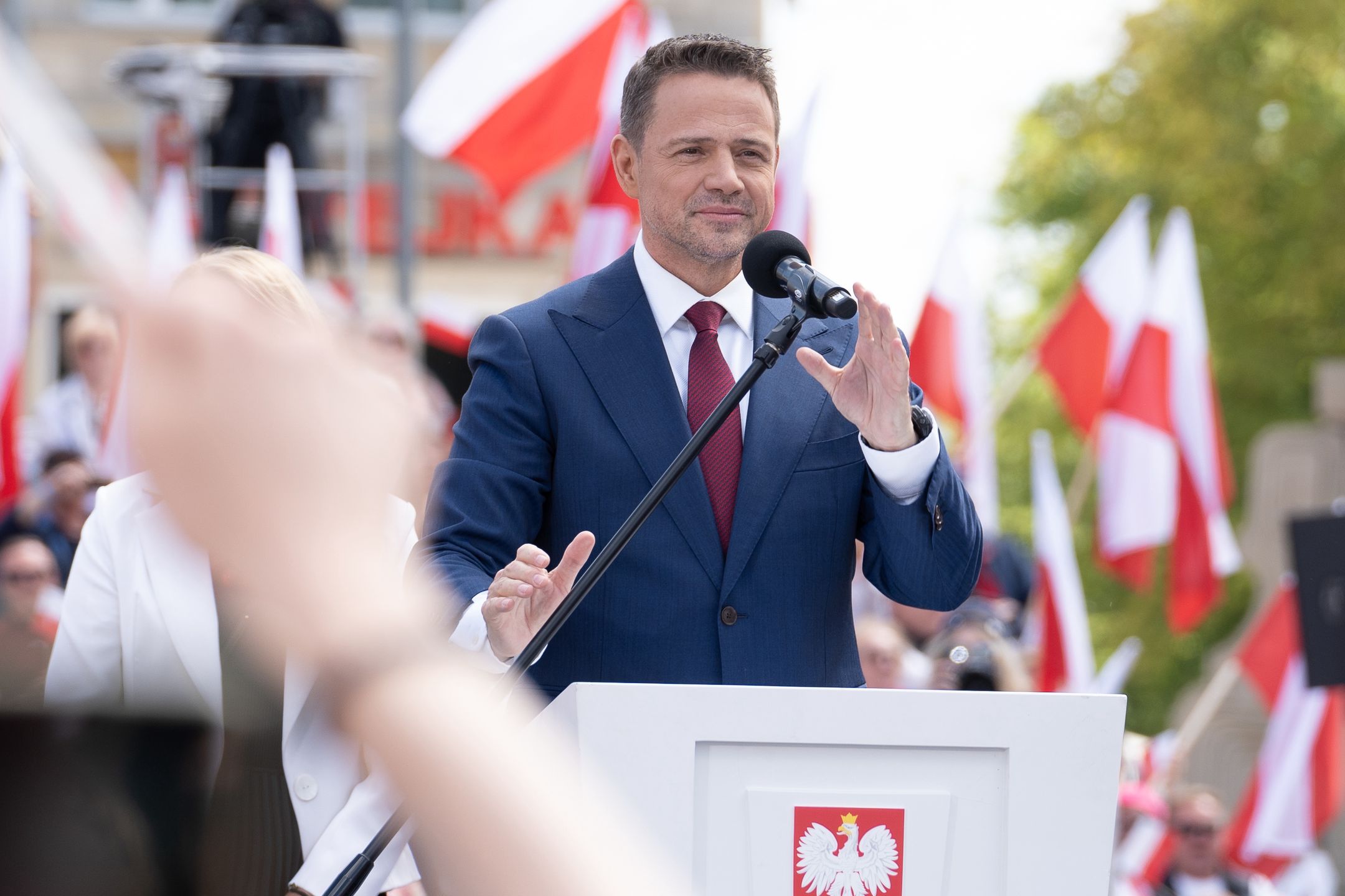 WARSAW, POLAND - 2025/05/25: The Mayor of Warsaw and the Civic Coalition (KO) presidential candidate, Rafal Trzaskowski delivers a speech as thousands of supporters listen to him during the Great Patriotic March a week before the second round of the presidential elections. Several Thousands of people marched with the candidate for President of Poland in a rally aimed to mobilise voters ahead of the run-off election round that will take place on June 1, 2025 in which the the centrist Warsaw mayor Rafa Trzaskowski, from prime minister Donald Tusk's governing pro-European coalition will face the Eurosceptic historian Karol Nawrocki, backed by the populist rightwing Law and Justice party (PiS). (Photo by Marek Antoni Iwaczuk/SOPA Images/LightRocket via Getty Images)