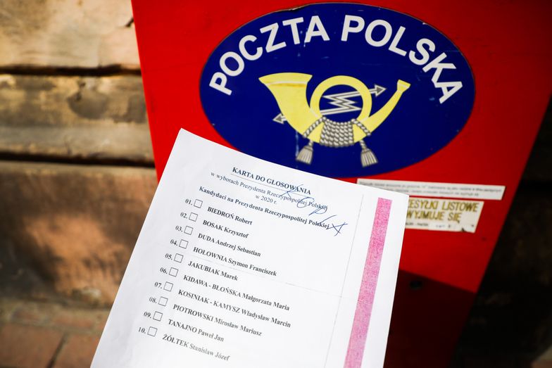 A copy of the 'election package' documents is photographed for illustration photo with Poczta Polska mailbox in the background. Krakow, Poland on May 2nd, 2020.  A voting package leaked in the upcoming correspondence election with a full list of candidates for Presidential office and with name and surname statement on secret voting. Despite coronavirus pandemic, Poland's government plans to hold the presidential election on May 10 in the form of a correspondence vote. (Photo by Beata Zawrzel/NurPhoto via Getty Images)