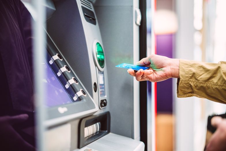 Female hand inserting bank card into automatic cash machine (ATM) to access bank account services in the city
Female hand inserting bank card into automatic cash machine (ATM) to access bank account services in the city. Cash withdrawing, paying bills, checking account balance, transferring money, currency exchange at ATM.  Self-service concept.
Images By Tang Ming Tung