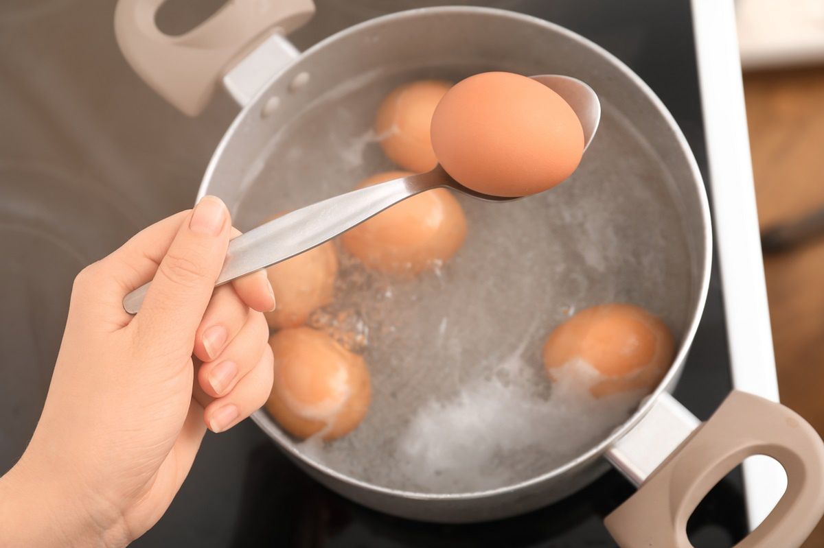 Add a bit to the water in which you boil eggs. They won't crack and will come out of the shells by themselves.