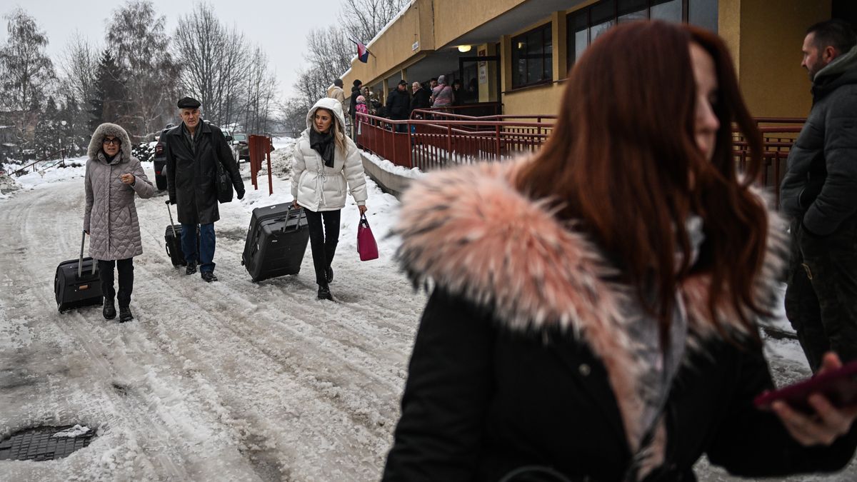 PRZEMYSL, POLAND - DECEMBER 16: Ukrainians exit the passport control as they arrive from Kyiv at the train station on December 16, 2022 in Przemysl, Poland. (Photo by Omar Marques/Anadolu Agency via Getty Images)