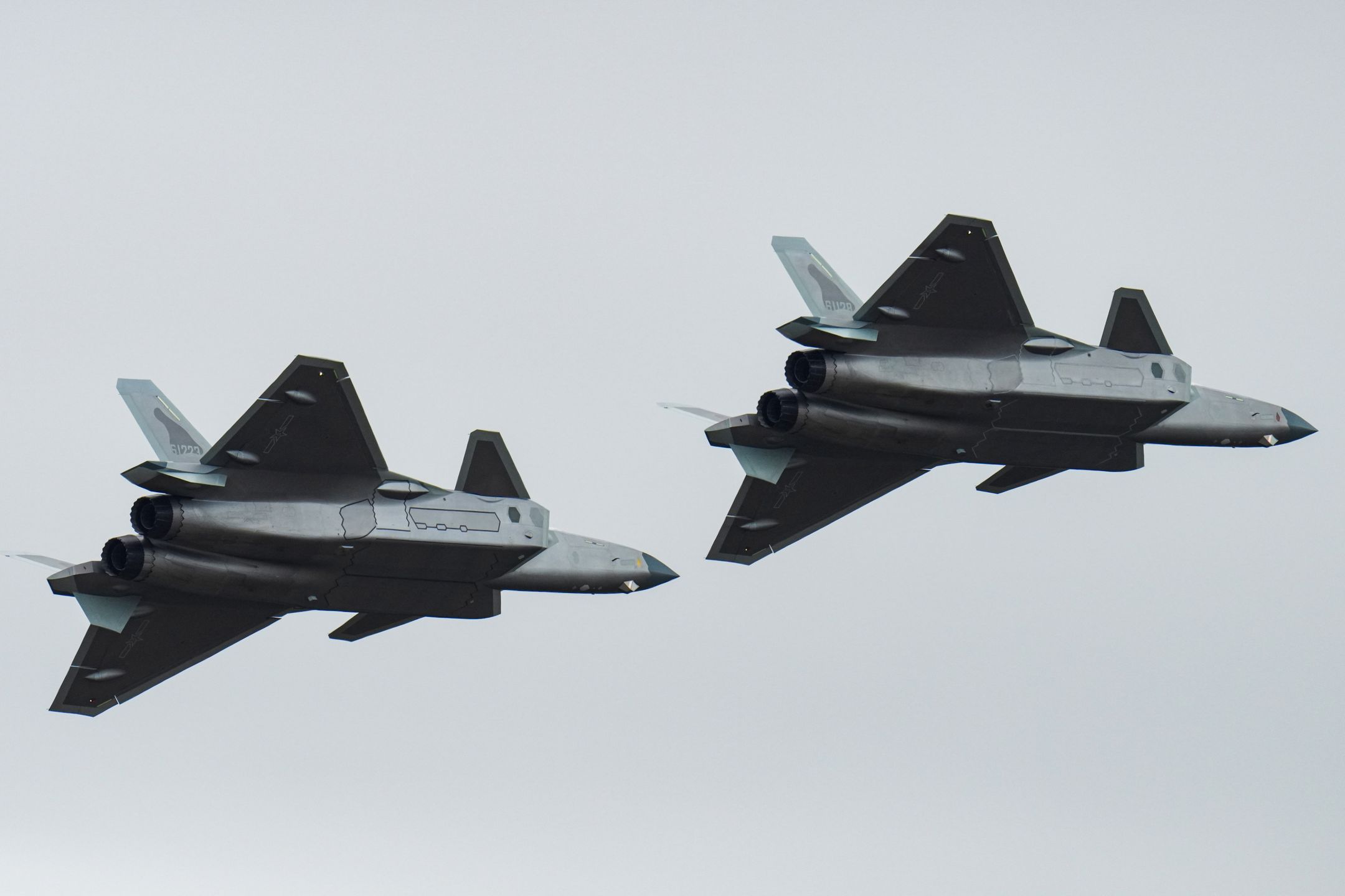 ZHUHAI, CHINA - NOVEMBER 15: J-20 stealth fighter jets perform in the sky on day 4 of the 15th China International Aviation and Aerospace Exhibition, or Airshow China 2024, on November 15, 2024 in Zhuhai, Guangdong Province of China. (Photo by Song Zeyi/VCG via Getty Images)