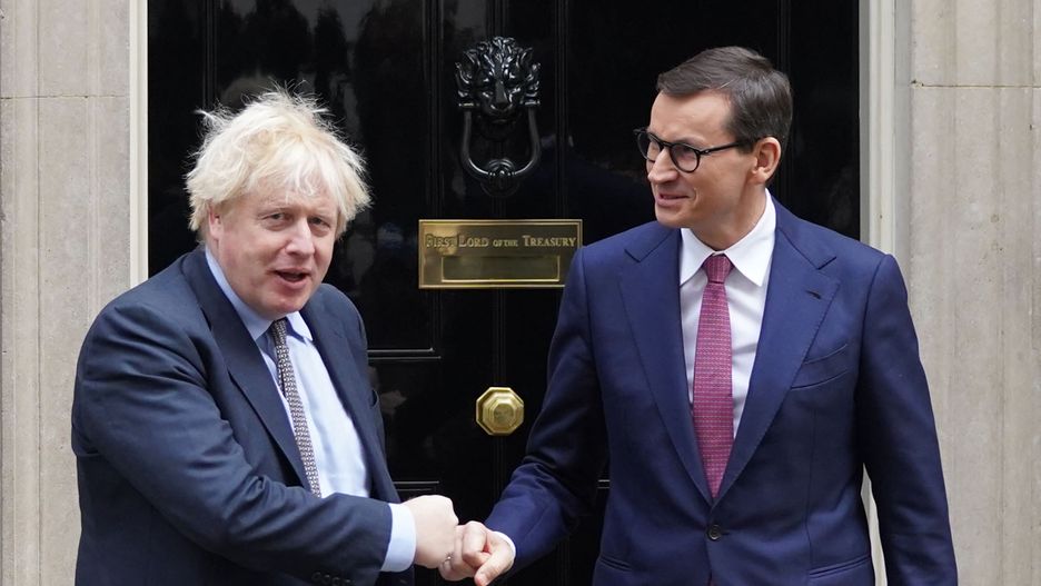Prime Minister Boris Johnson (left) greets Prime Minister of Poland Mateusz Morawiecki, outside 10 Downing Street, London, ahead of a bilateral meeting. Picture date: Friday November 26, 2021. (Photo by Stefan Rousseau/PA Images via Getty Images)