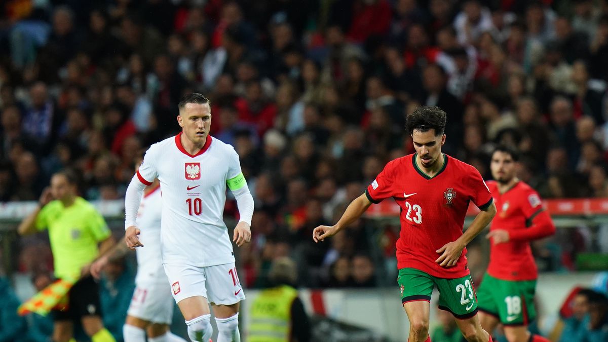 LISBON, PORTUGAL - NOVEMBER 15:  Vitinha of Portugal with Piotr Zielinski of Poland in action during the UEFA Nations League 2024/25 League A Group A1 match between Portugal and Poland at Estadio do Dragao on November 15, 2024 in Porto, Portugal.  (Photo by Gualter Fatia/Getty Images)