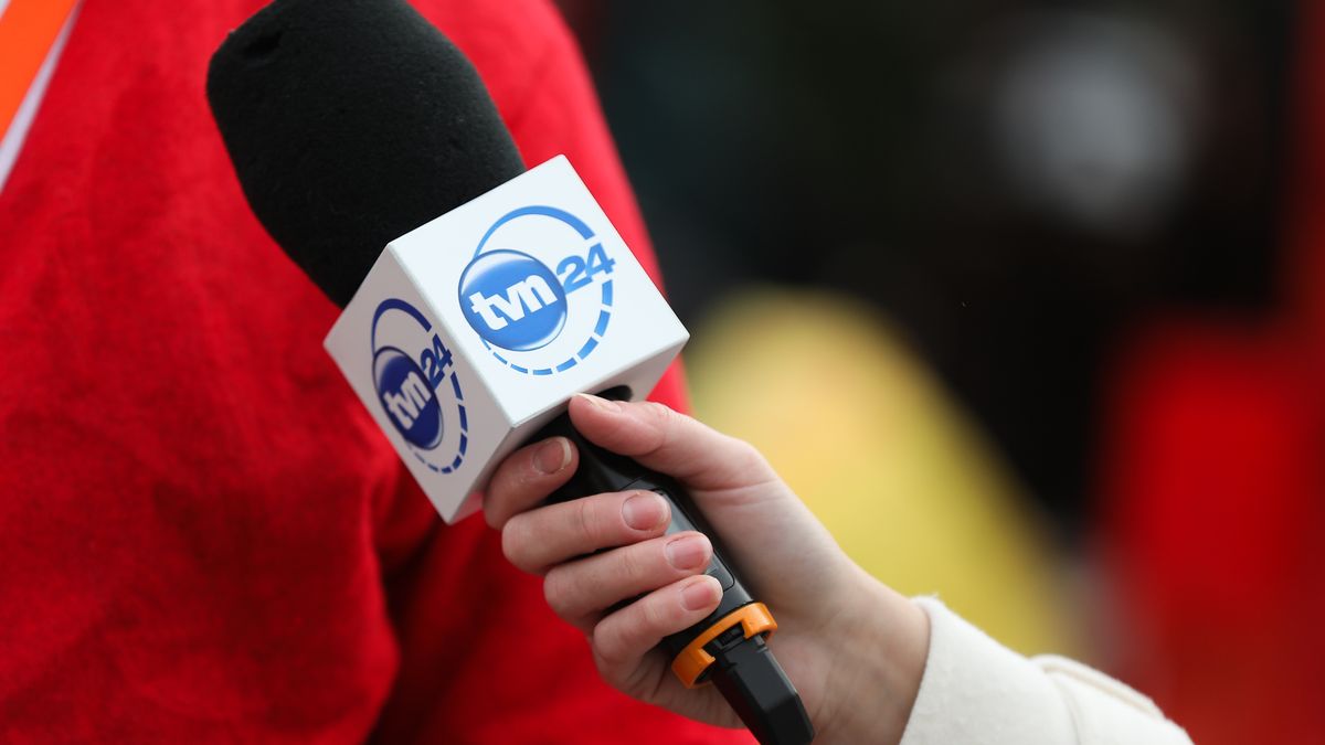 A microphone with the TVN television logo is present during the ''Christmas Eve for the Homeless and Needy'' event at the Main Square in Krakow, Poland, on December 22, 2024. Each year, just before Christmas, a special Christmas Eve gathering is organized at the Main Square for those in need. During the event, warm traditional holiday meals are served, with the initiative organized and sponsored by Jan Koscioszko. Additionally, a field hospital is set up at the Main Square, providing professional medical assistance to those in need. (Photo by Klaudia Radecka/NurPhoto via Getty Images)