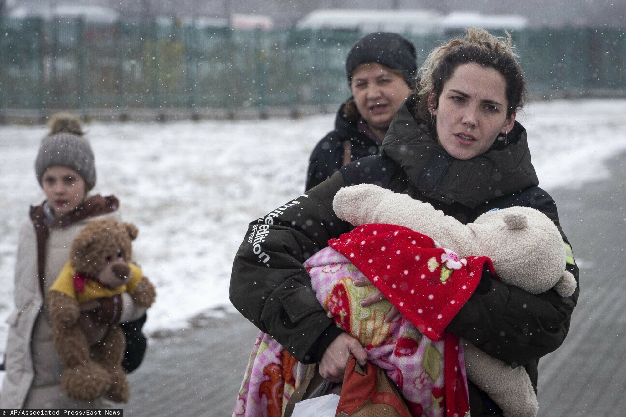TemporaryYulia Sivek holds Meron, 2 months old, after fleeing from Ukraine, at the border crossing in Medyka, Poland, Wednesday, March 9, 2022. U.N. officials said that the Russian onslaught has forced 2 million people to flee Ukraine. It has trapped others inside besieged cities that are running low on food, water and medicine amid the biggest ground war in Europe since World War II. (AP Photo/Visar Kryeziu)AP