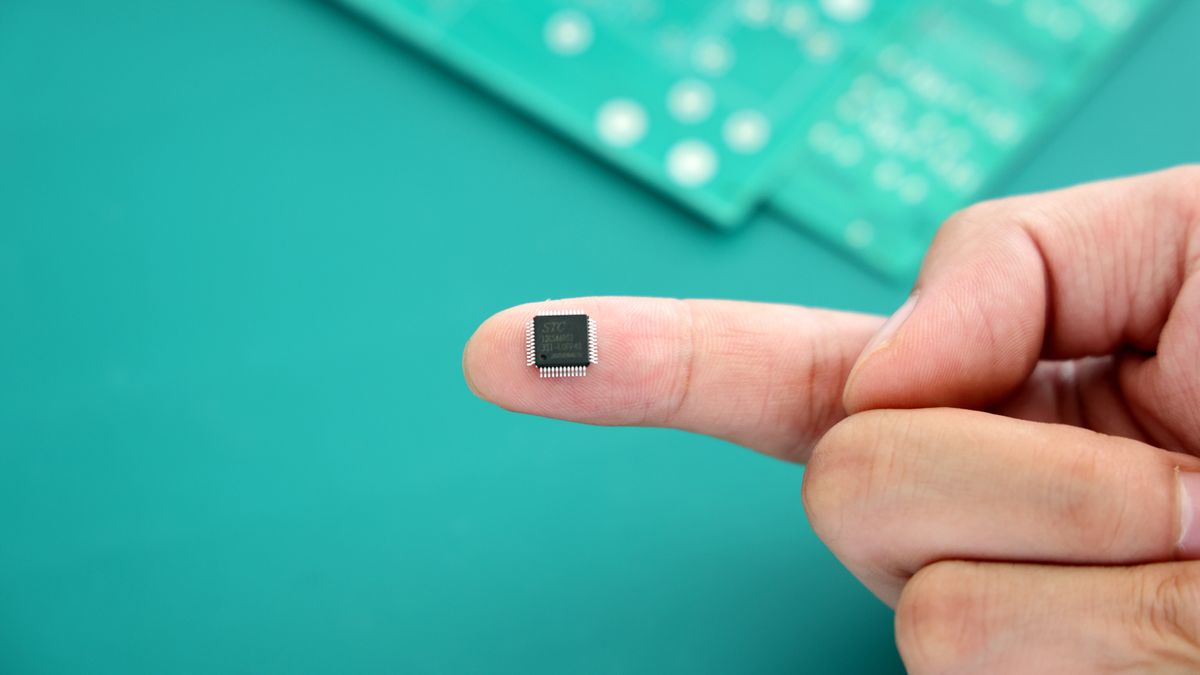 BINZHOU, CHINA - JUNE 16, 2022 - A technician shows a controller chip used in the production of integrated circuit board products at Black Dot Electronics Technology Co., LTD in Xingfu Town of Boxing County, Binzhou City, East China's Shandong Province, June 16, 2022. (Photo credit should read CFOTO/Future Publishing via Getty Images)