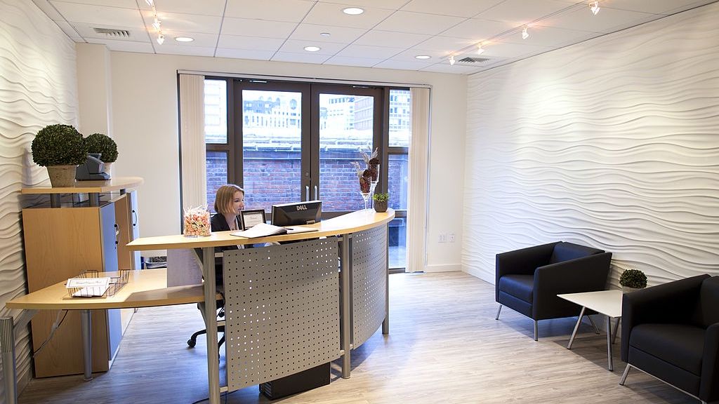 Boston Offers Grit, Glamour In Shared Startup Spaces
BOSTON - DECEMBER 30: This is the shared reception area at SnapSuites, which rents polished, high-end office spaces in the Back Bay. (Photo by Dina Rudick/The Boston Globe via Getty Images)
Boston Globe