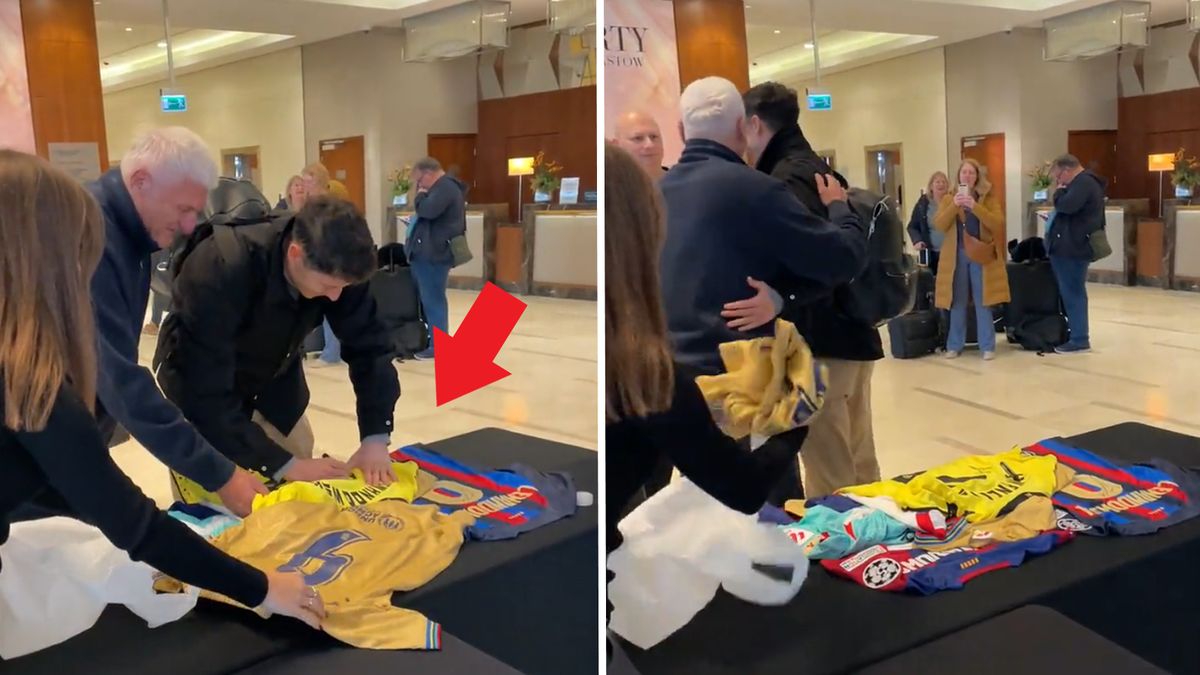 Robert Lewandowski podpisujący koszulki swojego kibica