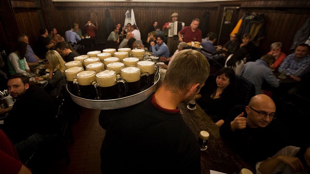 Czech Beer Day
PRAGUE, CZECH REPUBLIC - SEPTEMBER 26:  A waiter distributes glasses of dark beer to customers at the famed U Fleku pub on the eve of the Czech Beer Day on September 26, 2014 in Prague, Czech Republic.  The tradition of the Czech Beer Day was founded by the Czech Beer and Malthouse Association last year to strengthen pride in the Czech national drink. People can celebrate Czech Beer Day on September 27  in 4000 pubs and restaurants around Czech Republic, who invite them to drink draft beer. (Photo by Matej Divizna/Getty Images)
Matej Divizna
Human Interest, Leisure Activity, Lifestyles, Topics, Travel, World Culture