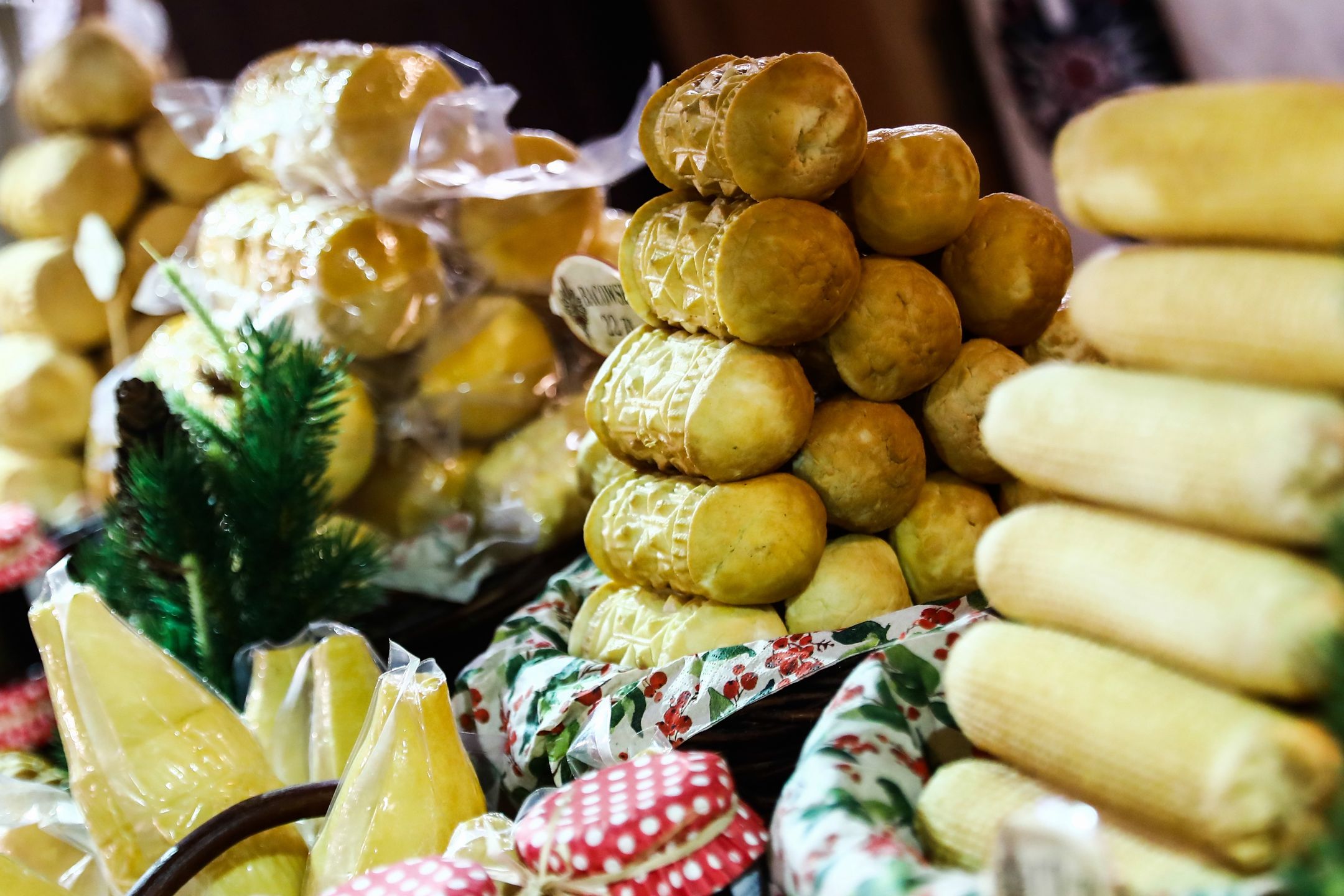 Traditional cheese called Oscypek is seen at a stand at the Christmas market in Krakow, Poland on December 15, 2021. (Photo by Jakub Porzycki/NurPhoto via Getty Images)