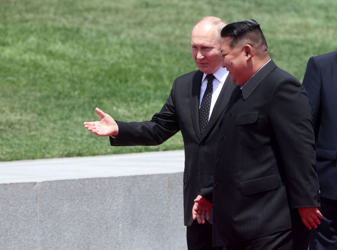 Vladimir Putin and Kim Jong Un