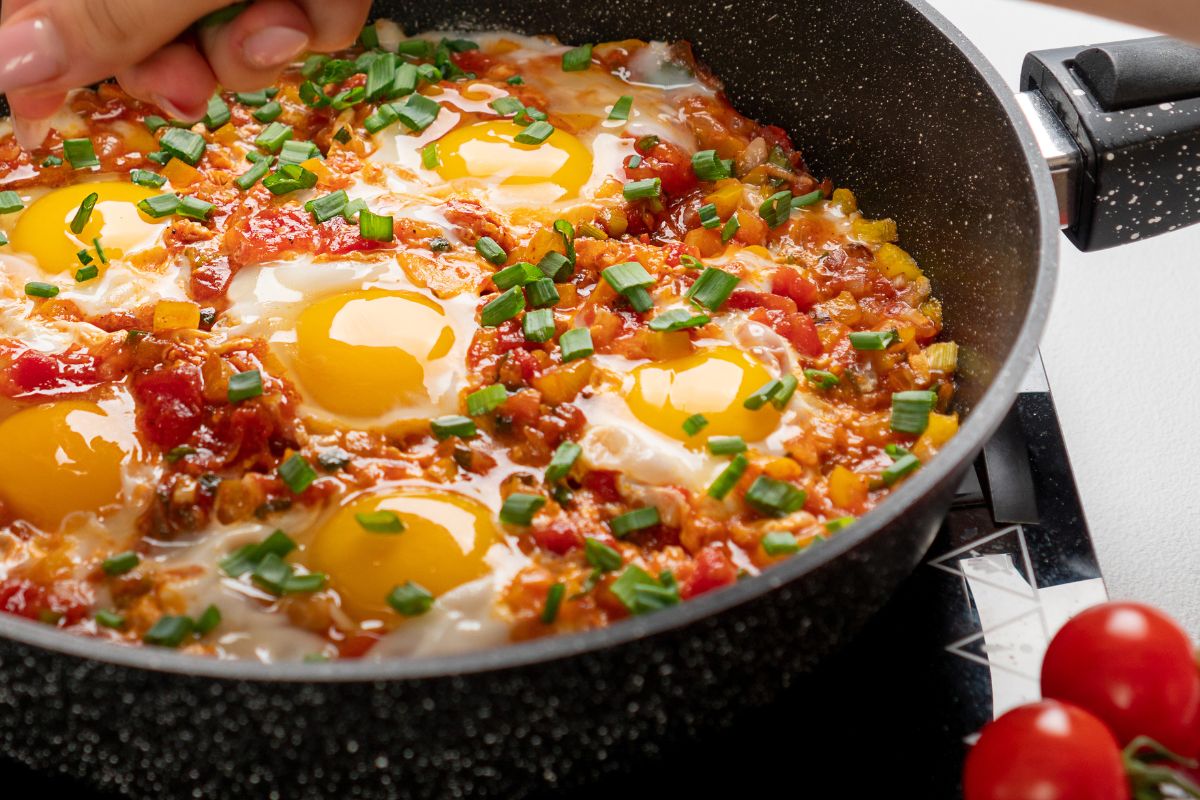 Menemen can be well-cooked, but you can also leave the yolks almost raw.