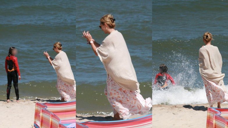 Anna Kalczyńska pije piwo na plaży i fotografuje pociechy