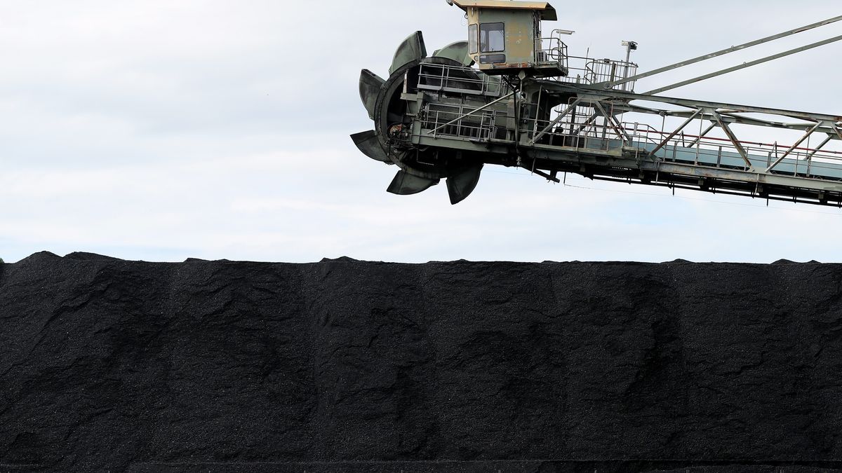 A stockpile of coal at Eraring Power Station in Eraring, New South Wales, Australia, on Thursday, April 28, 2022. At Eraring Power Station's cavernous turbine hall as much as 6 million tons of coal a year is crushed and loaded into furnaces which reach temperatures of 1,480 degrees Celsius (2,696 Fahrenheit)  about enough to melt steel  to heat 24-story high water-filled boilers. Photographer: Brendon Thorne/Bloomberg via Getty Images