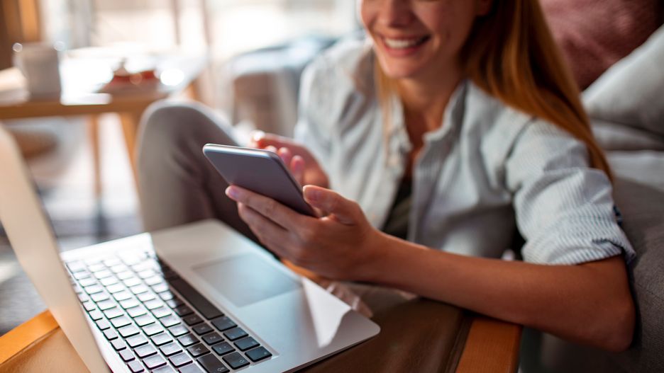 Smiling young woman using smartphone with laptop at homeSmiling young woman using smartphone with laptop at homePeople, Smiling, Young, Woman, Smartphone, Laptop, Home, Caucasian, Female, Technology, Happiness, Work, Connectivity, Social Media, Online Communication, Wireless Technology, Modern Tech, Professional, Casual, Comfort, Remote Work, Home Office, Internet, Digital Device, Leisure Activity, Positive Emotion, Female Professional, Entrepreneur, Freelancer, Business, Home Workspace, Telecommuting, E-Commerce, Virtual Meeting, Indoor Lifestyle, Urban Living, Tech Savvy, Mobile Technology, Home Environment, Female Entrepreneur, Efficiency, Productivity, Self-Employed, Modern Lifestyle, Wireless Connection, Occupation, Activity, Lifestyles, Copy Space, people, smiling, young, woman, smartphone, laptop, home, caucasian, female, technology, happiness, work, connectivity, social media, online communication, wireless technology, modern tech, professional, casual, comfort, remote work, home office, internet, digital device, leisure activity, positive emotion, female professional, entrepreneur, freelancer, business, home workspace, telecommuting, e-commerce, virtual meeting, indoor lifestyle, urban living, tech savvy, mobile technology, home environment, female entrepreneur, efficiency, productivity, self-employed, modern lifestyle, wireless connection, occupation, activity, lifestyles, copy space