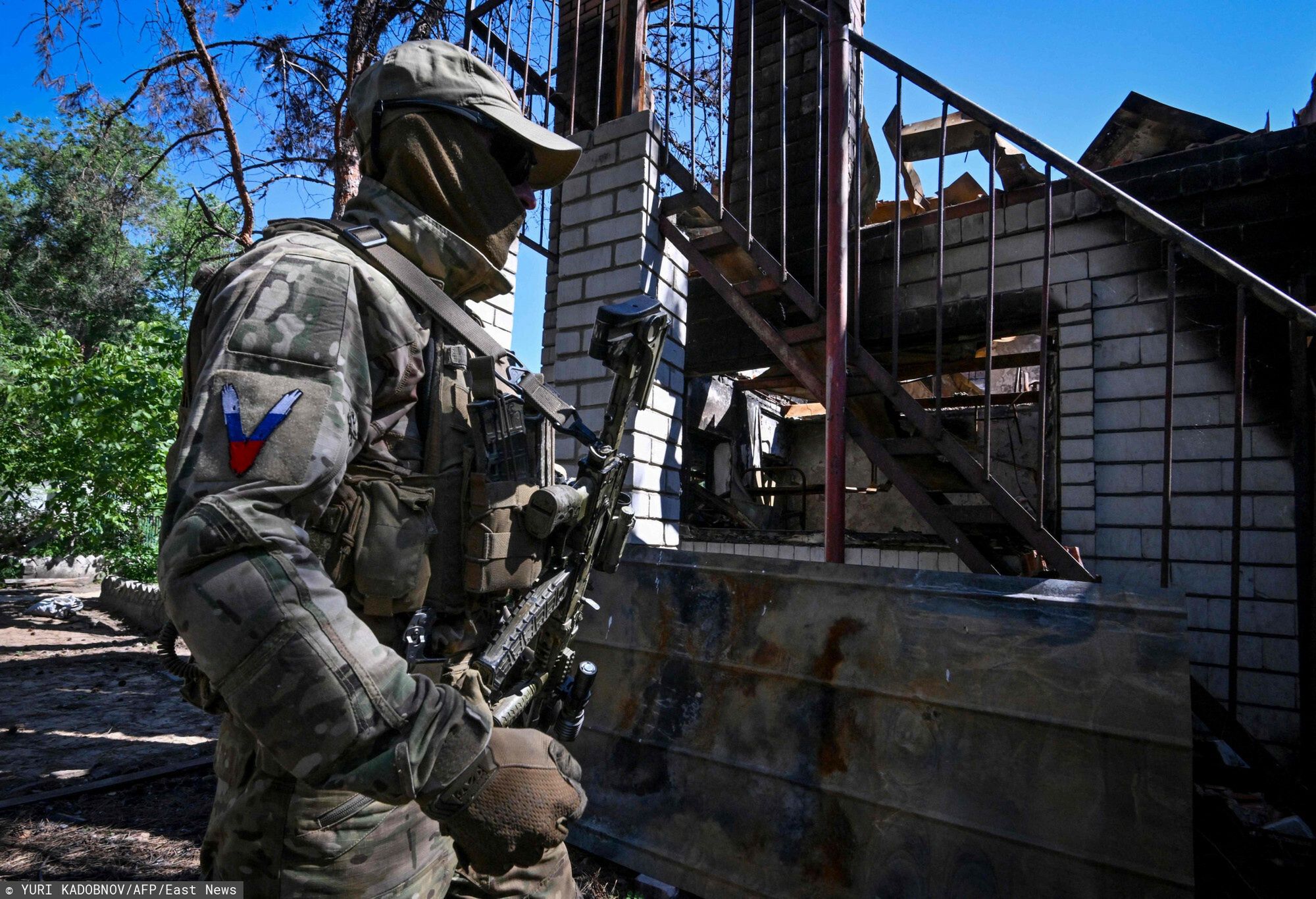 Temporary
A Russian serviceman patrols the captured piont of defence of Ukrainian army outside the town of Schast'ye on June 11, 2022, amid the ongoing Russian military action in Ukraine. (Photo by Yuri KADOBNOV / AFP)
YURI KADOBNOV