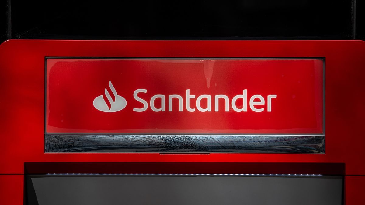 A logo above an automated teller machine (ATM) outside a Banco Santander SA bank branch in Barcelona, Spain, on Monday, Jan. 31, 2022. Santander reports full year earnings on February 2. Photographer: Angel Garcia/Bloomberg via Getty Images