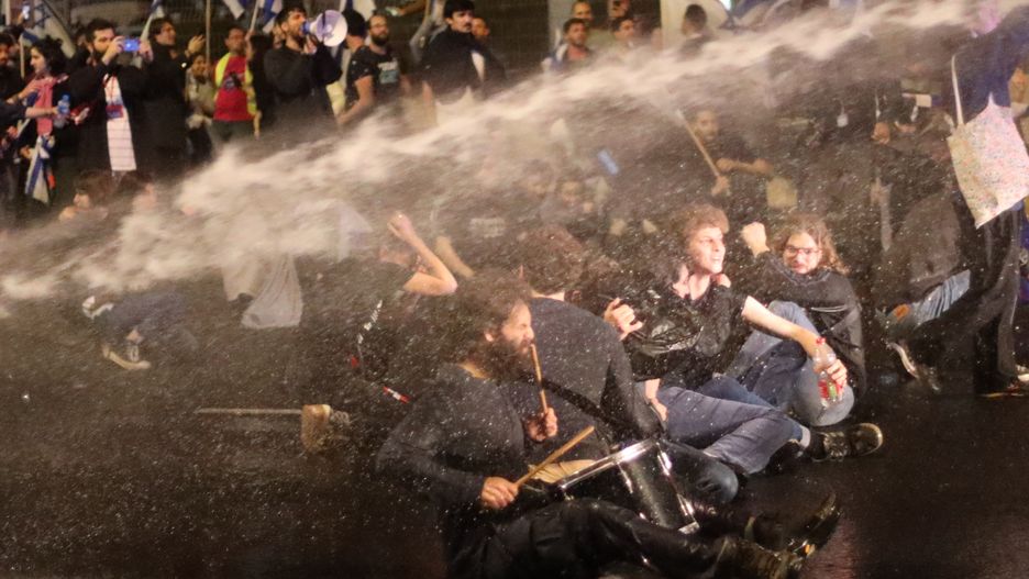 TEL AVIV, ISRAEL - APRIL 1: Israeli forces intervene in demonstrators during a rally against the government's judicial reform bill in Tel Aviv, Israel on April 1, 2023. (Photo by Saeed Qaq/Anadolu Agency via Getty Images)