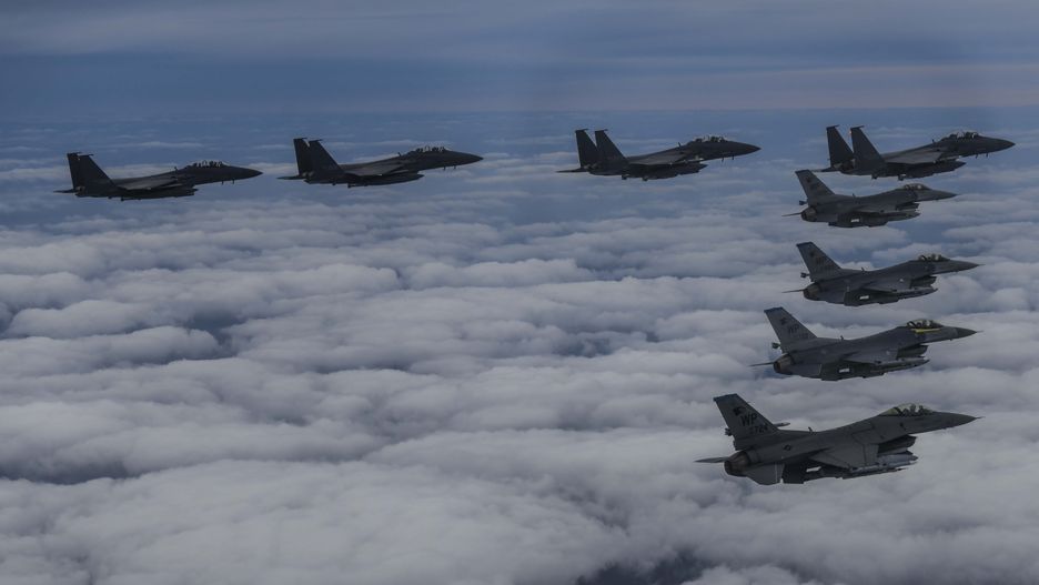 UNDISCLOSED LOCATION - OCTOBER 04: In this handout image released by the South Korean Defense Ministry, South Korean Air Force F-15Ks and U.S. Air Force F-16 fighter jets fly over the Korean Peninsula in response to North Korea's intermediate-range ballistic missile (IRBM) launch earlier in the day, on October 04, 2022 at an undisclosed location. North Korea fired an intermediate-range ballistic missile (IRBM) over Japan on Tuesday in its first launch of an IRBM in eight months, according to South Korea’s military. (Photo by South Korean Defense Ministry via Getty Images)