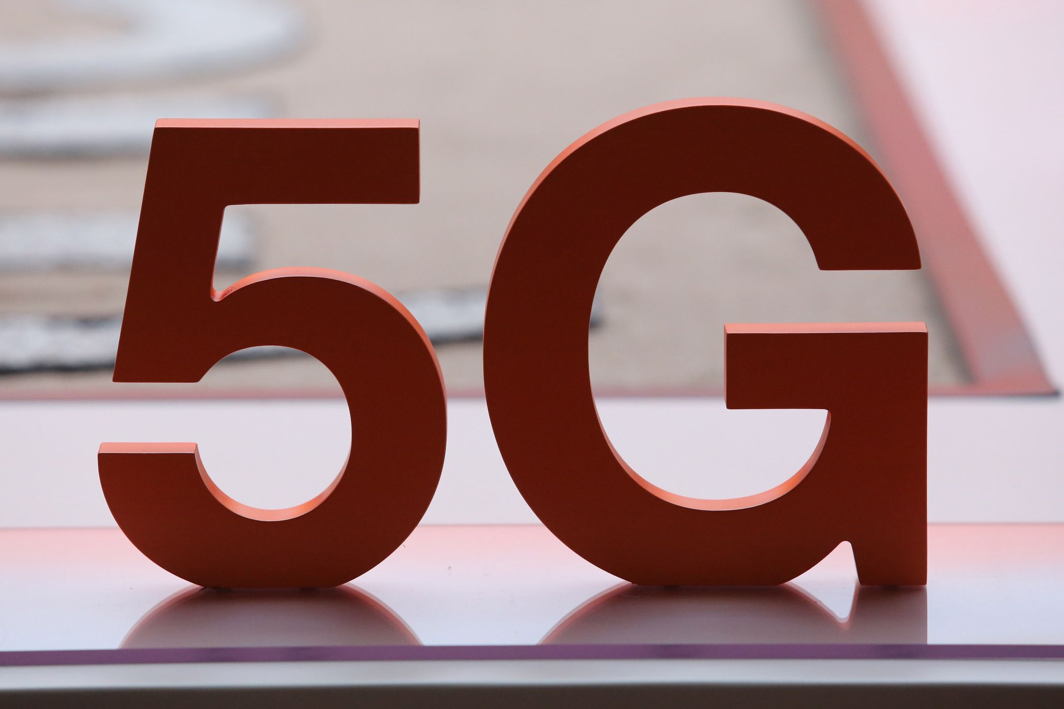 A 5G motif on the Orange SA stand on the opening day of the MWC Barcelona at the Fira de Barcelona venue in Barcelona, Spain, on Monday, June 28, 2021. MWC Barcelona, which in 2019 attracted 109,000 attendees from 198 countries, was one of the first major European conference casualties due to the pandemic when it was axed in February last year. Photographer: Angel Garcia/Bloomberg via Getty Images