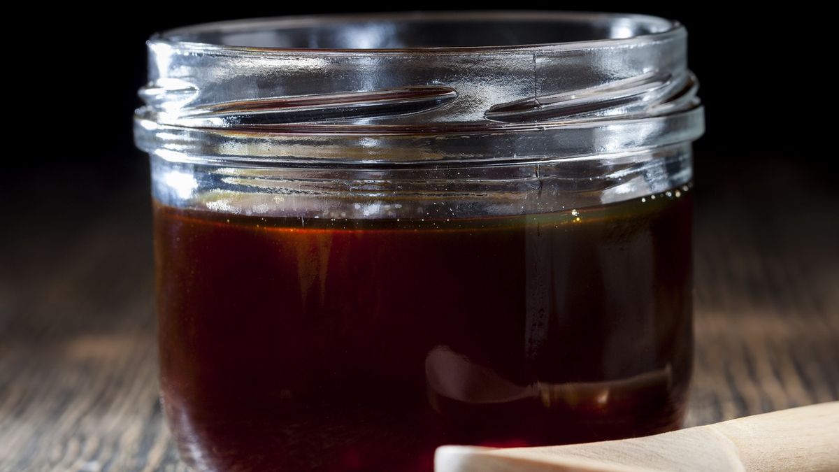 thick and sweet buckwheat honey of dark red colorthick and sweet buckwheat honey of dark red color from buckwheat flowers, natural bee buckwheat honey has a viscous and thick consistency and a red hueligoraviscous, comb-honey