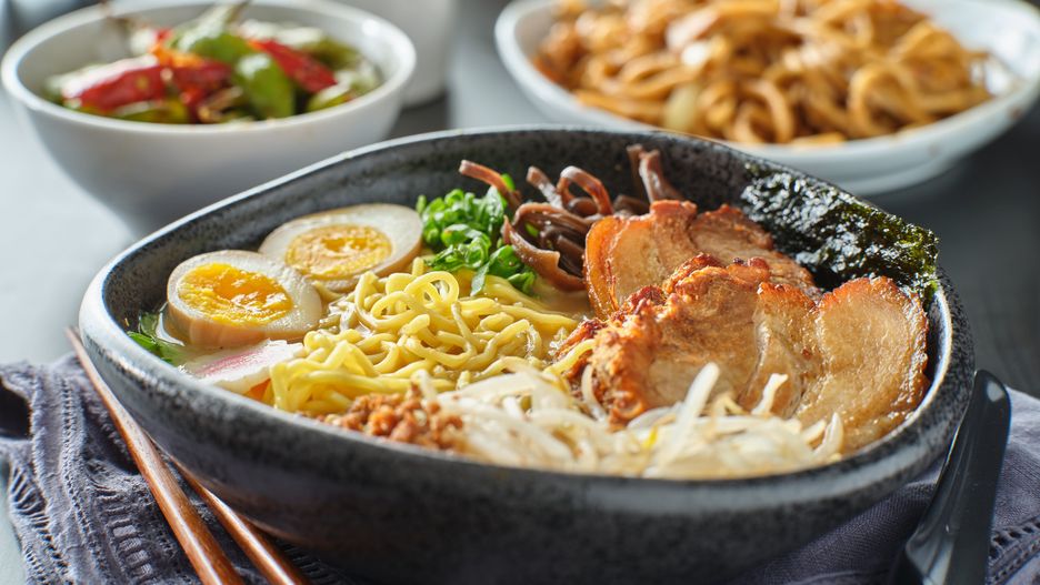 japanese tonkotsu ramen bowl on dinner table at restaurantfood, ramen, japanese, soup, noodles, tonkotsu, asian, broth,  e